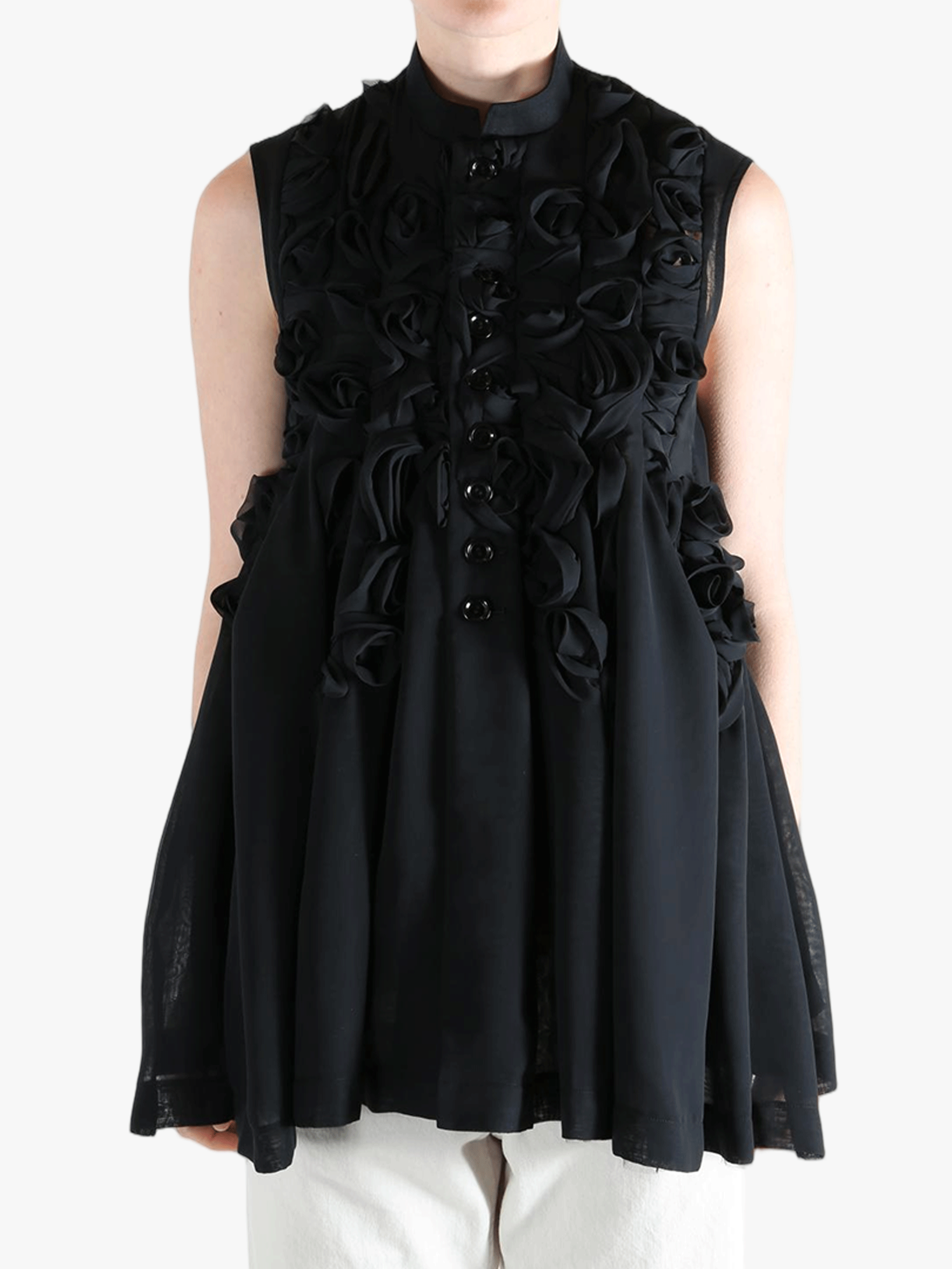 Black vest worn by a person, showing the vest's fit