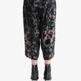 Black pant worn by a person, showing the pant's fit