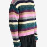 Green knitwear worn by a person, showing the knitwear's fit