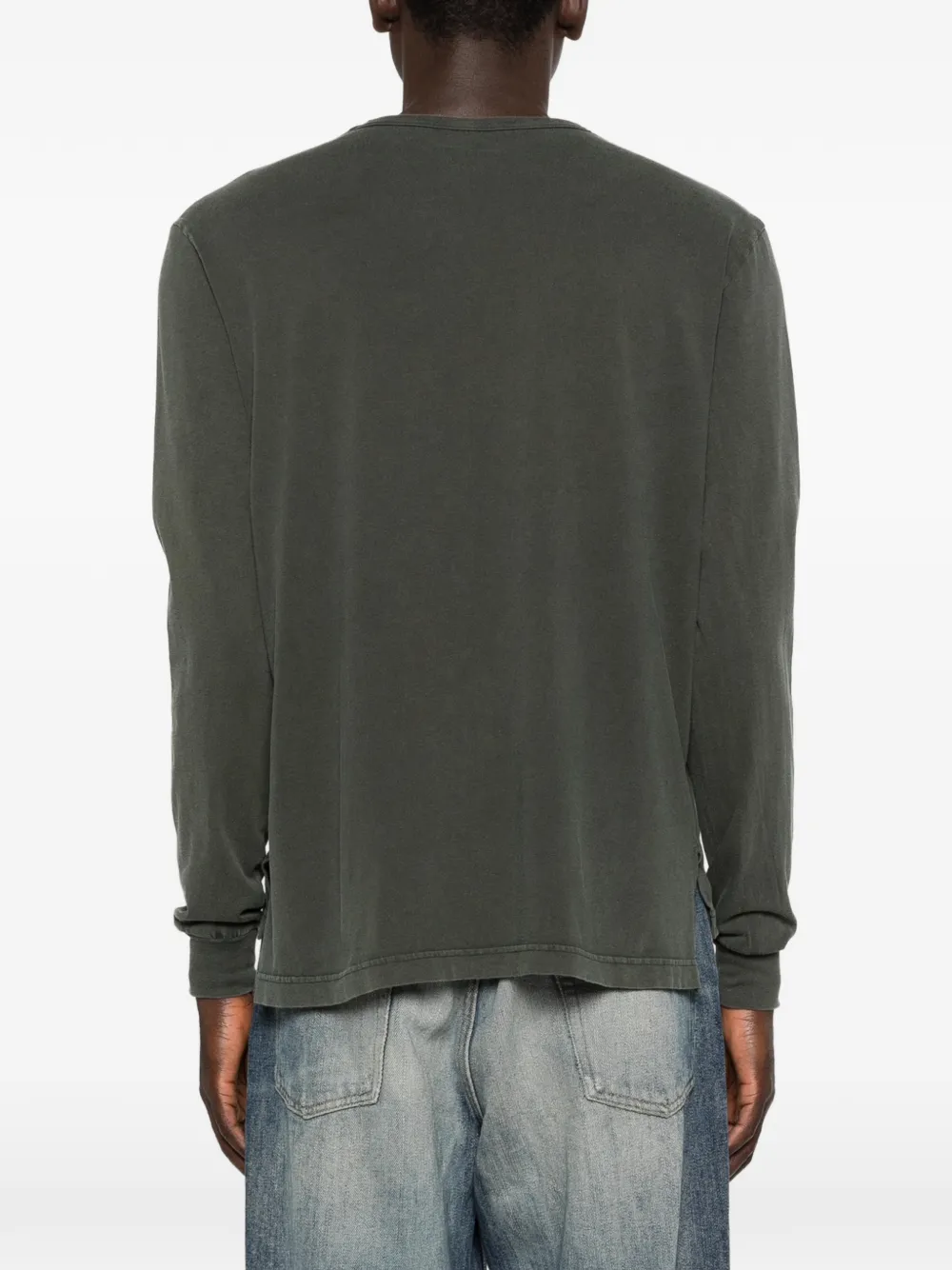 Grey knitwear worn by a person, showing the knitwear's fit