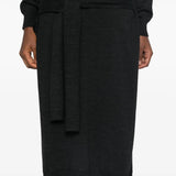 Close up of the black dress, showing texture of the acrylic and wool fabric