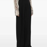 Black pants worn by a person, showing the pants fit