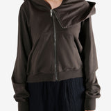 Brown hoodie worn by a person, showing the hoodie's fit