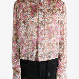 Pink shirt worn by a person, showing the shirt's fit