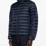 navy jacket worn by a person, showing the jacket fit