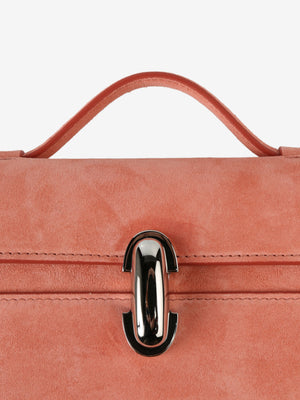 Close up of pink bag, showing the bag's turn-lock flap