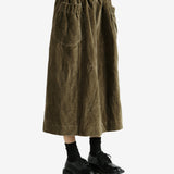 Green skirt worn by a person, showing the skirt's fit