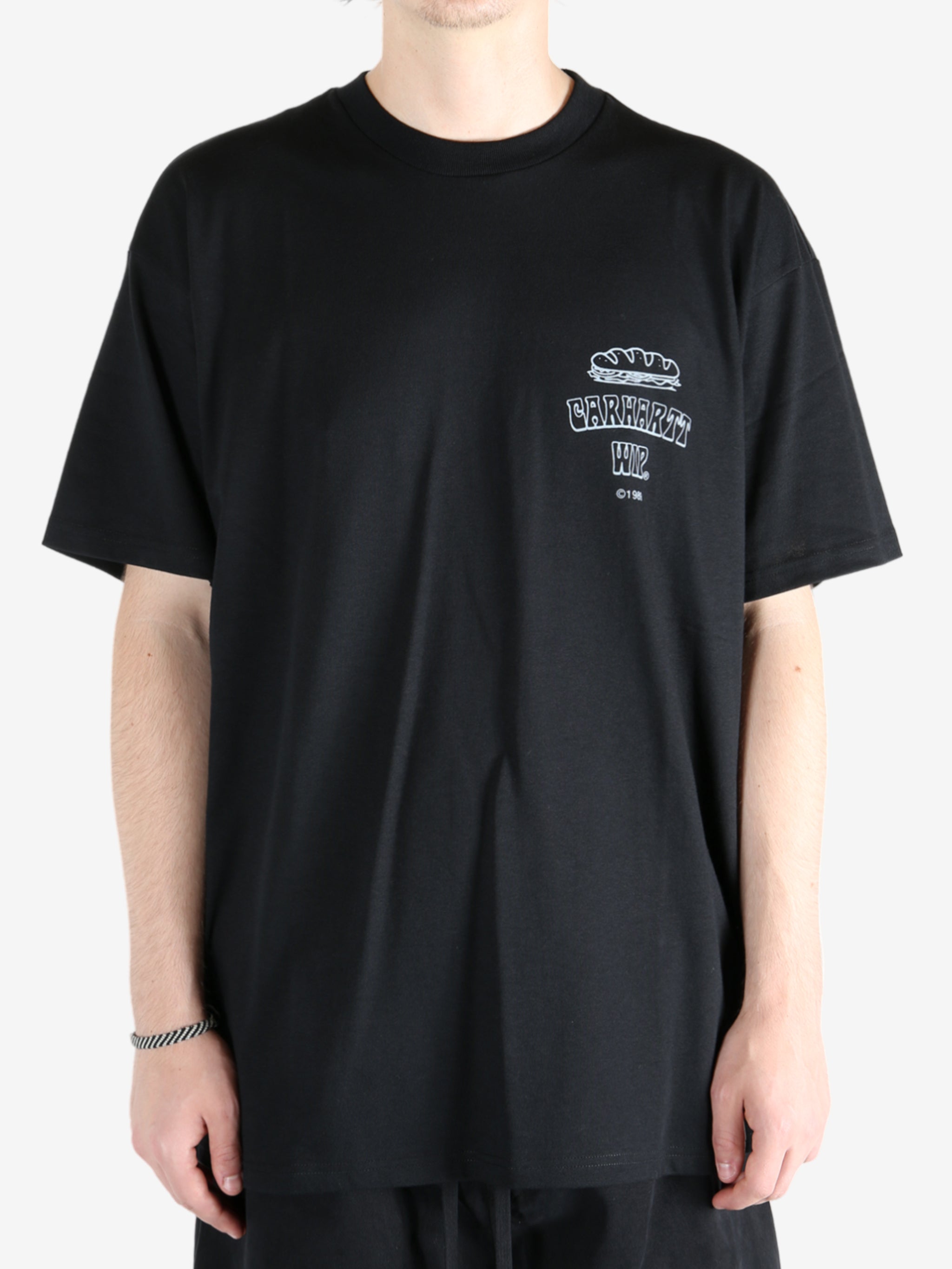 Black t-shirt worn by a person, showing the t-shirt's fit