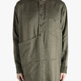 Grey top worn by a person, showing the top's fit