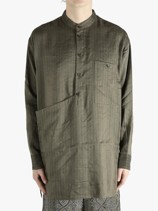 Grey top worn by a person, showing the top's fit