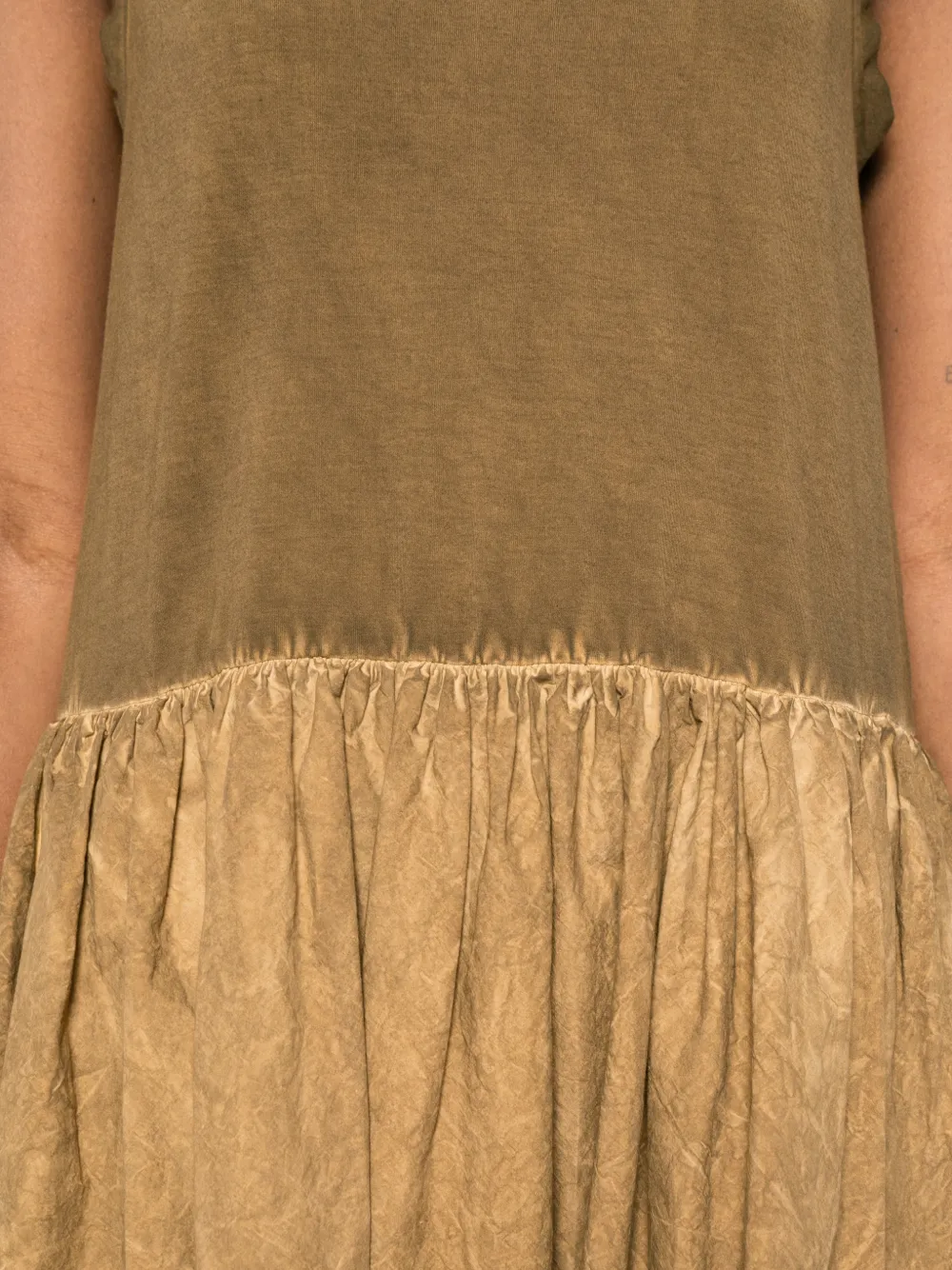 Close up of brown dress,showing texture of the cotton fabric