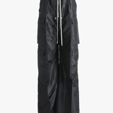 Black pants worn by a person, showing the pants's fit