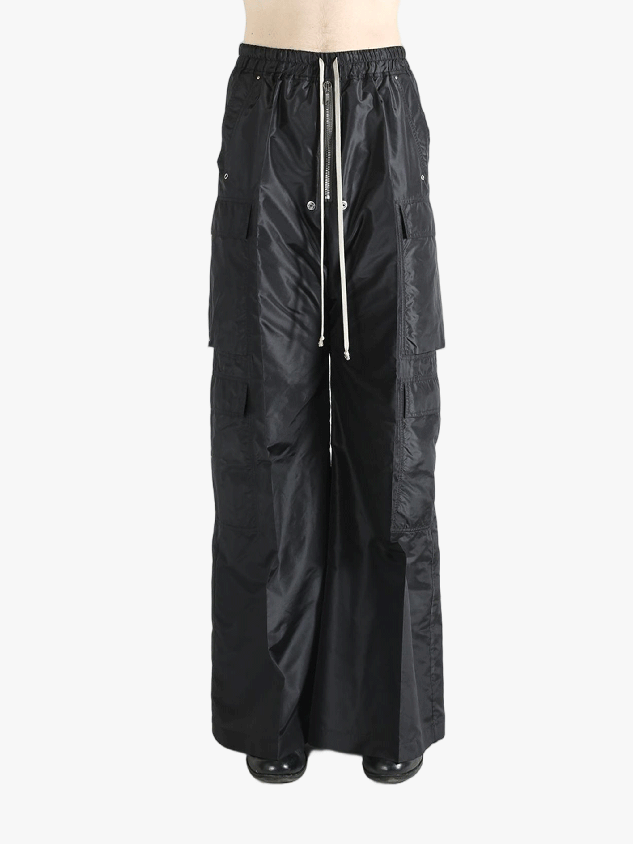 Black pants worn by a person, showing the pants's fit