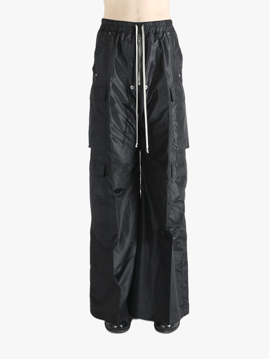 Black pants worn by a person, showing the pants's fit