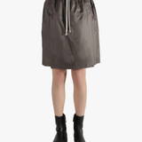 Brown shorts worn by a person, showing the shorts fit