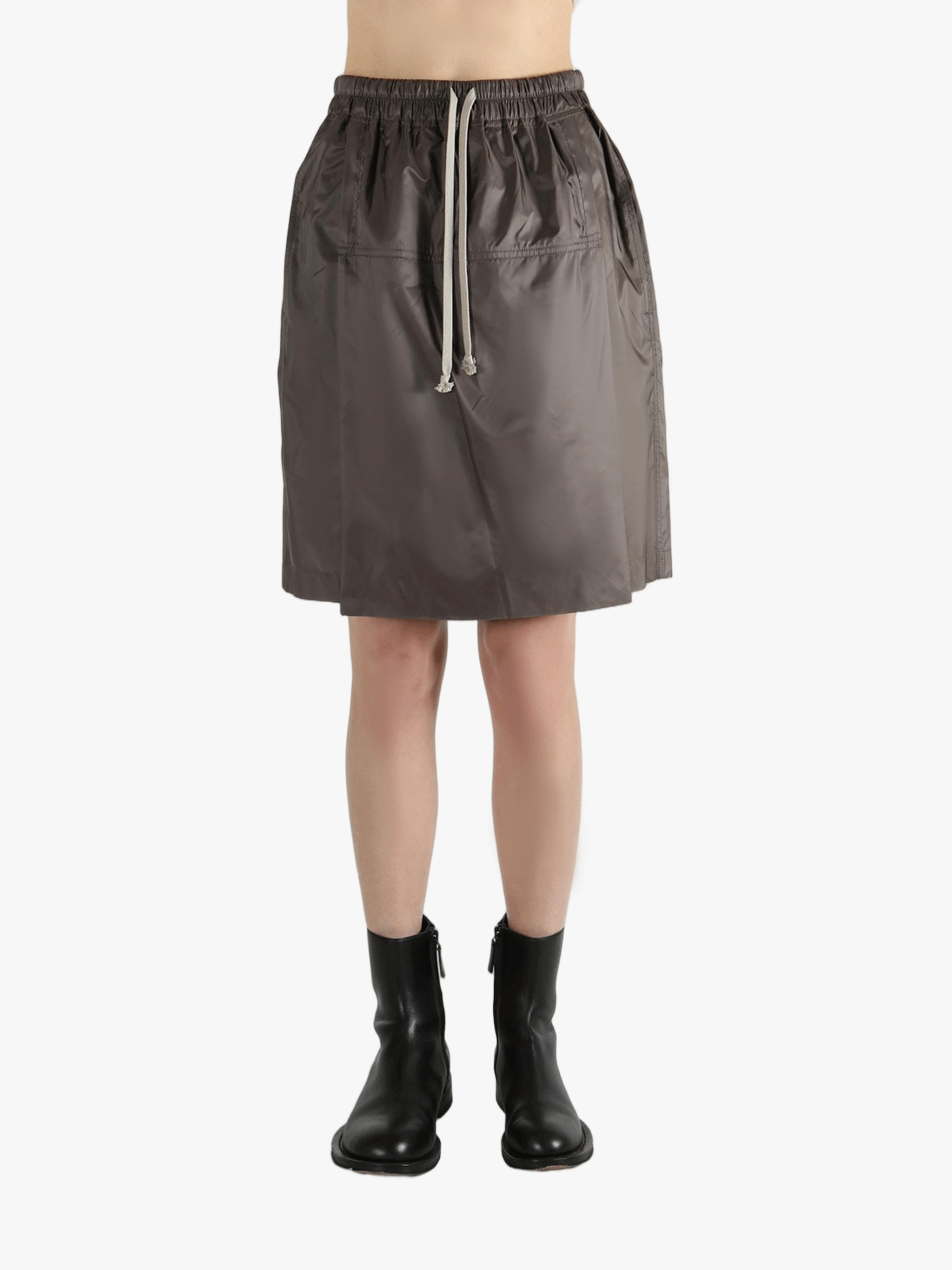 Brown shorts worn by a person, showing the shorts fit