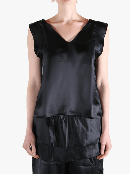 Black top worn by a person, showing the top's fit