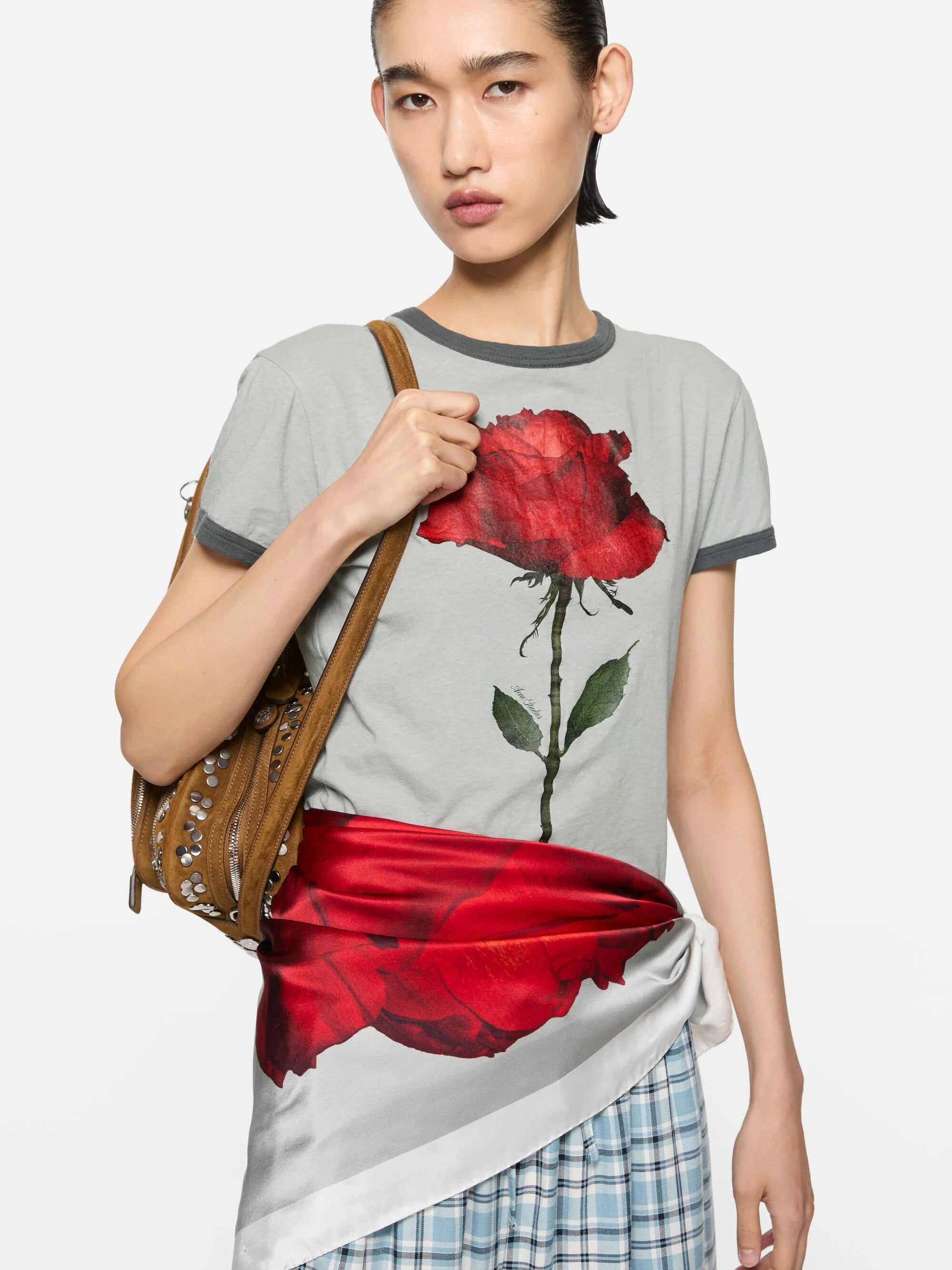 Grey t-shirt worn by a person, showing the t-shirt fit