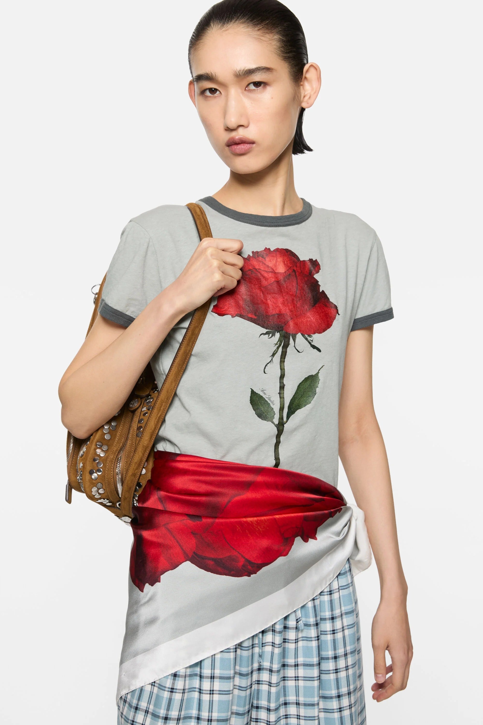 Grey t-shirt worn by a person, showing the t-shirt fit