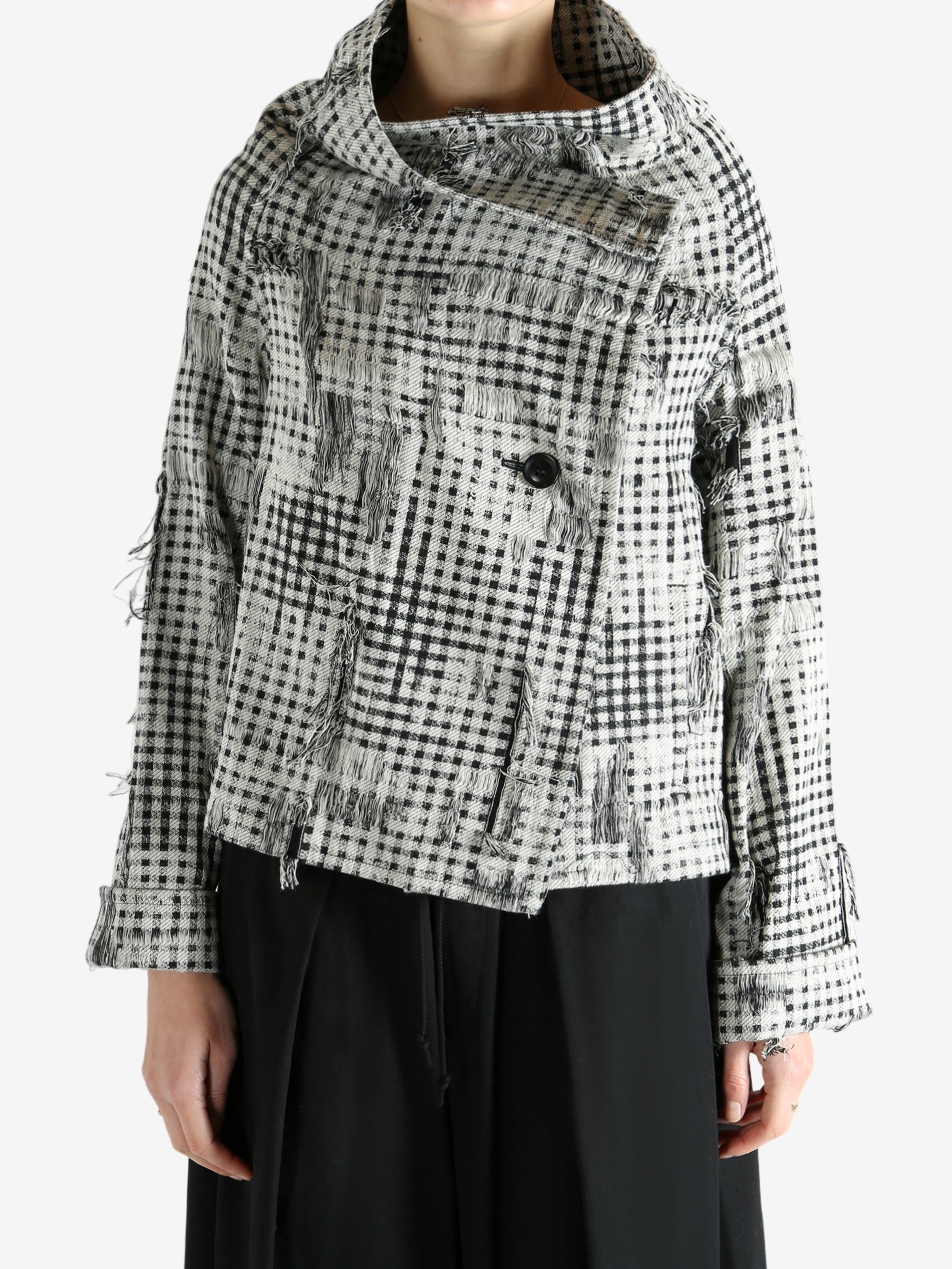 Black jackets worn by a person, showing the jackets fit