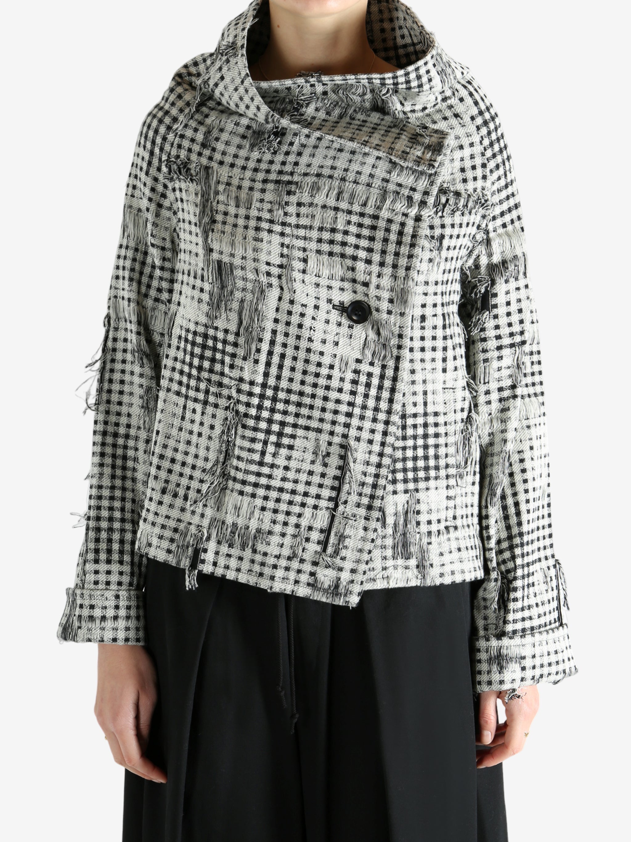 Black jackets worn by a person, showing the jackets fit