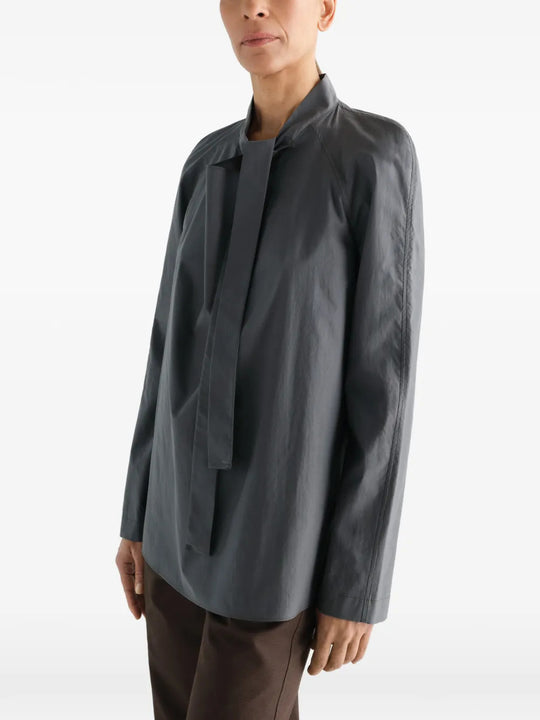 Grey dress worn by a person, showing the dress fit