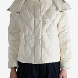 White jacket worn by a person, showing the jacket's fit