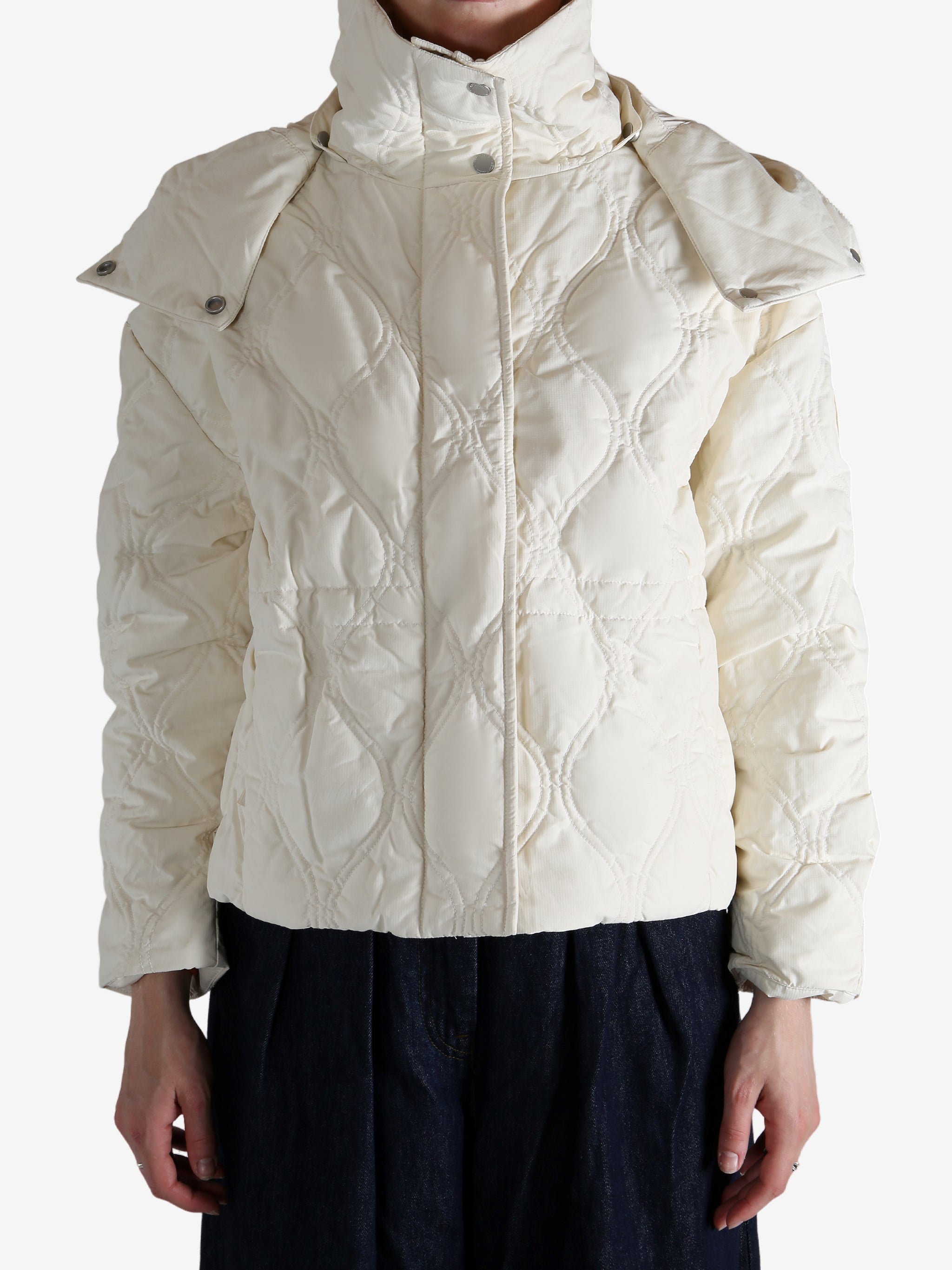 White jacket worn by a person, showing the jacket's fit