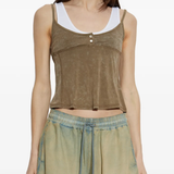Brown top worn by a person, showing the top's fit