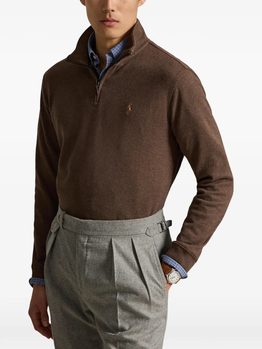 Brown knitwear worn by a person, showing the knitwear fit