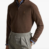 Brown knitwear worn by a person, showing the knitwear fit