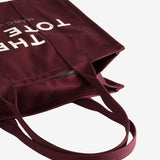 Close up of red bag, showing texture of the cotton fabric