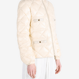 White jacket worn by a person, showing the jacket fit