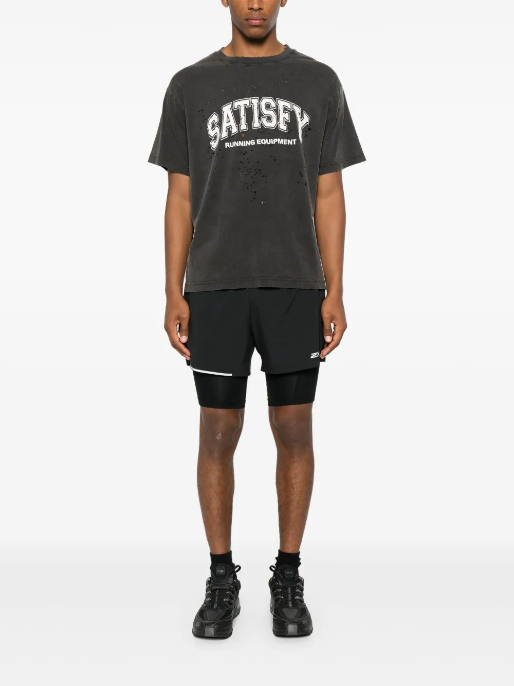 Black shirt worn by a person, showing the shirt fit