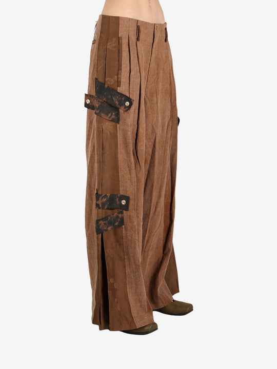 Brown pant worn by a person, showing the pant’s fit