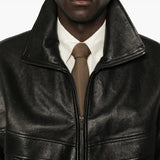 Black jacket worn by a person, showing the jacket fit