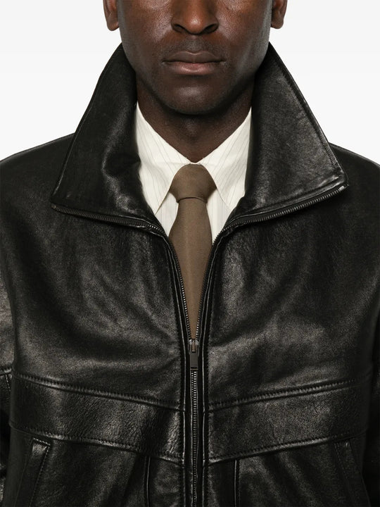 Black jacket worn by a person, showing the jacket fit