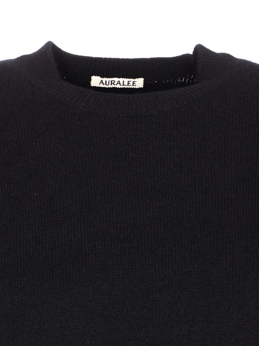 Close up of black sweater, showing texture of the cotton fabric