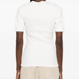 White shirt worn by a person, showing the shirt's fit