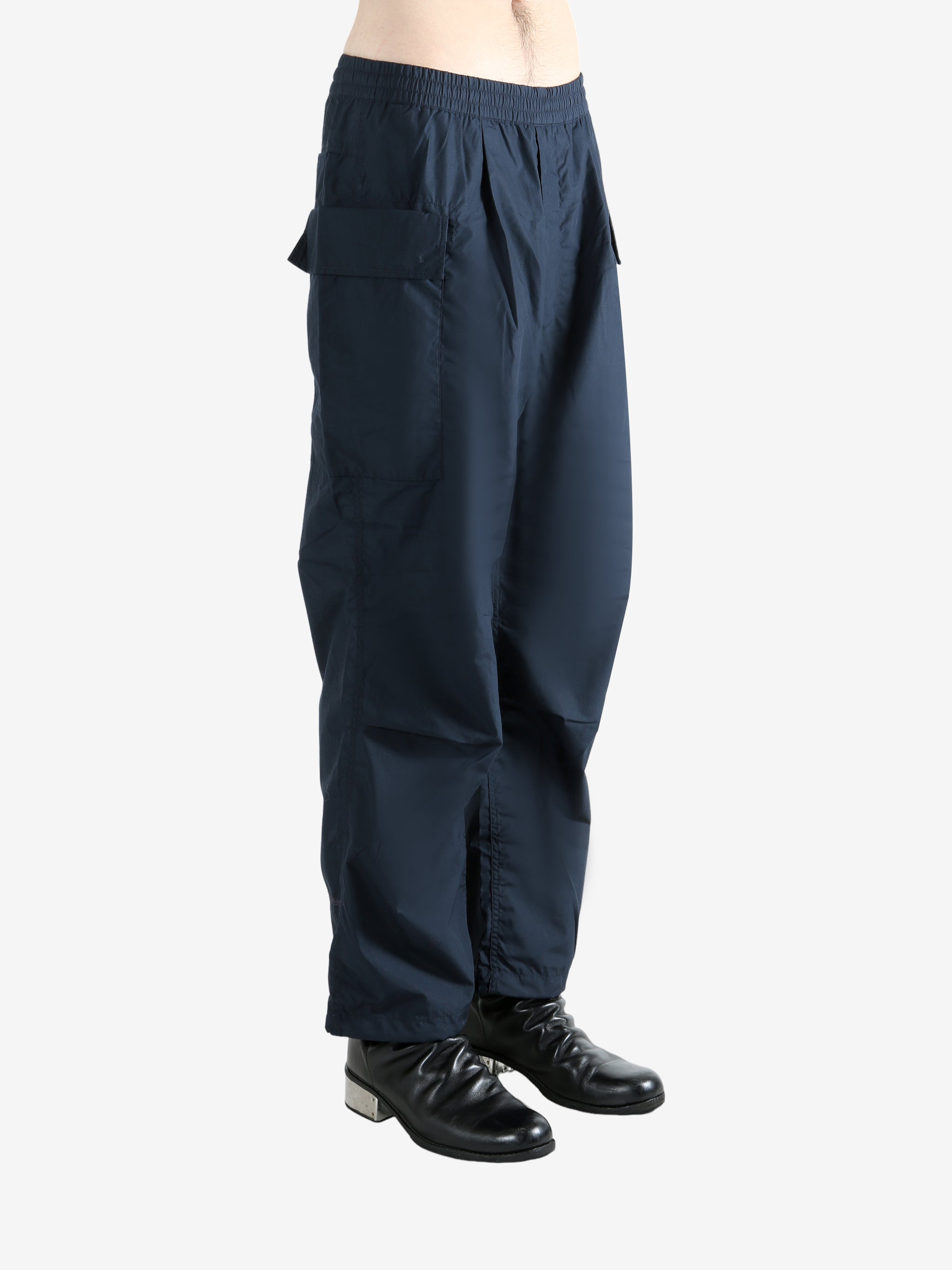 Navy pants worn by a person, showing the pants' fit