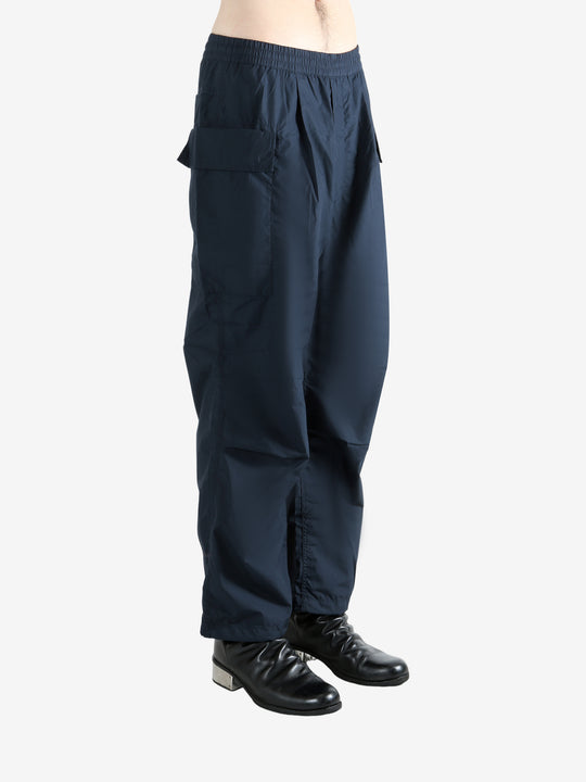 Navy pants worn by a person, showing the pants' fit