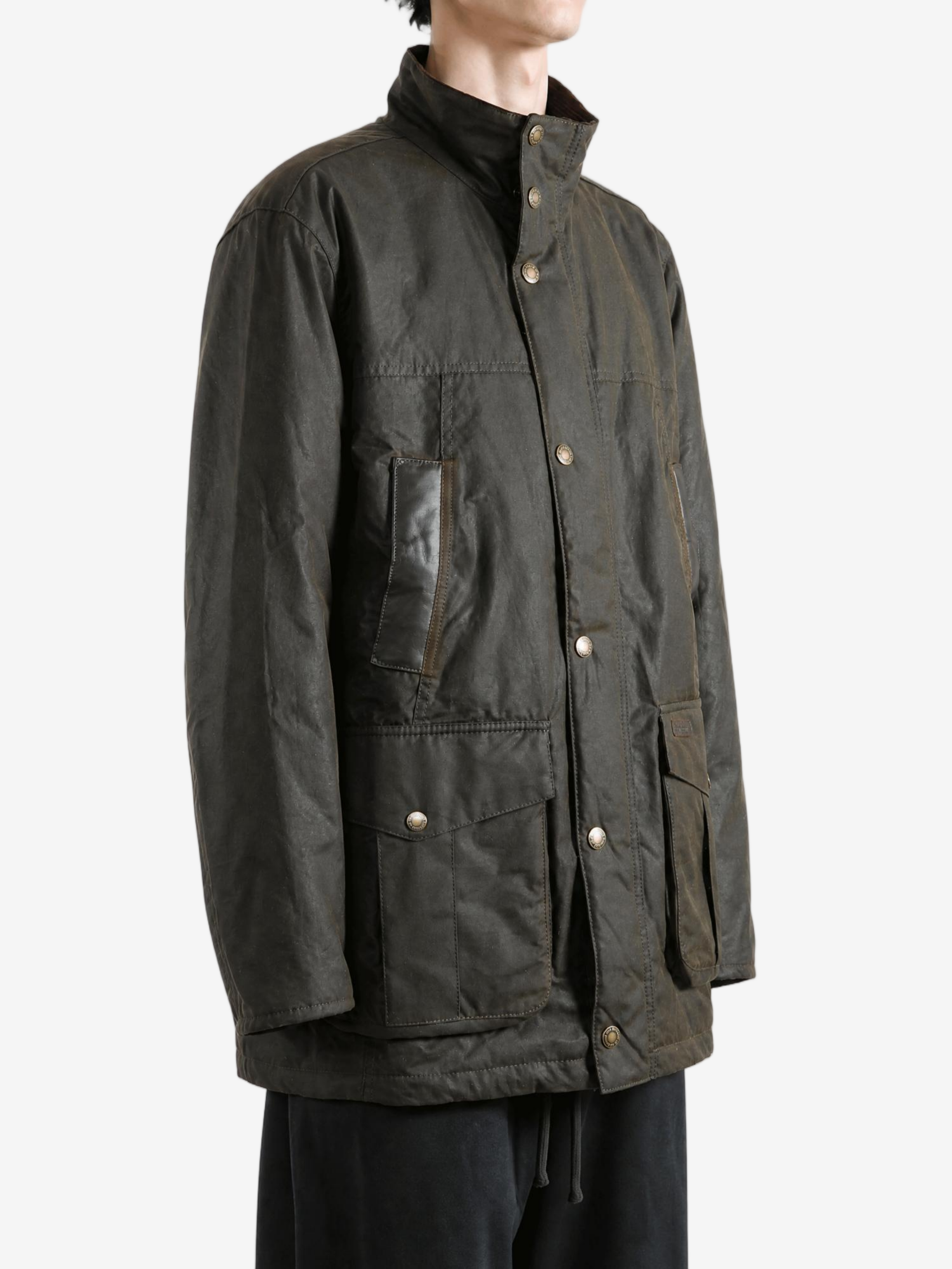 Brown jacket worn by a person, showing the jacket fit