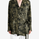 Green jacket worn by a person, showing the jacket fit