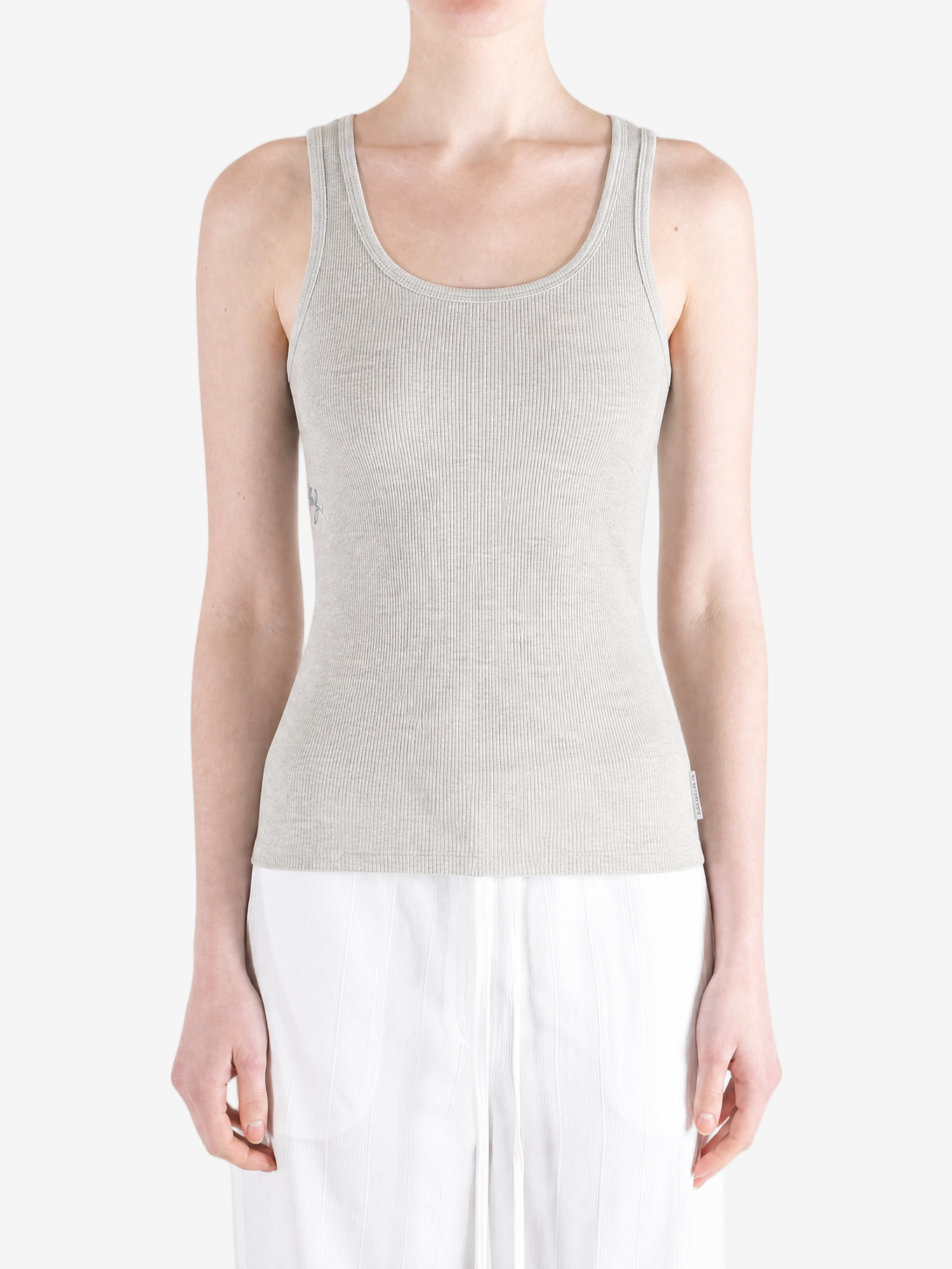 Tan top worn by a person, showing the top fit