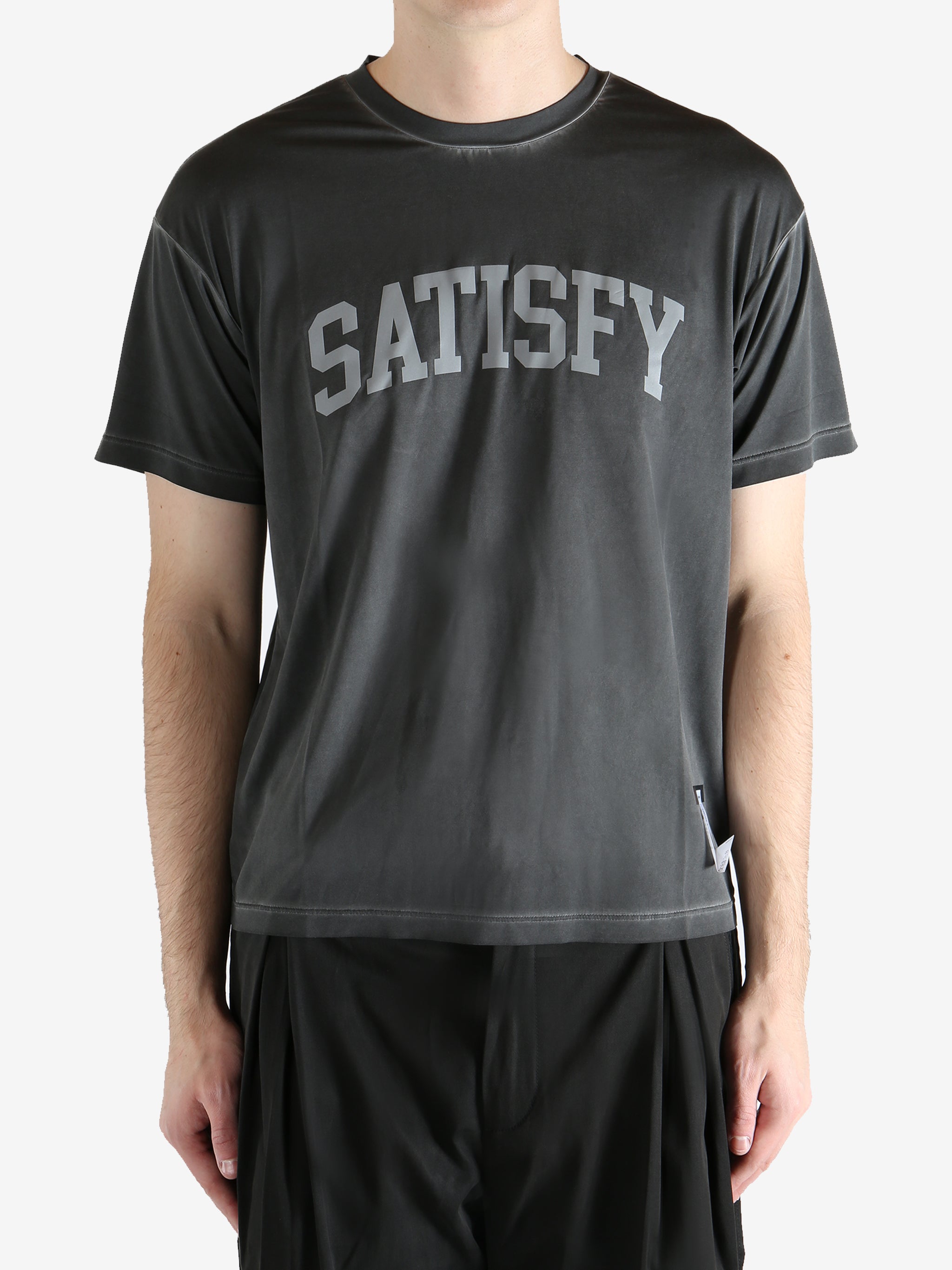 Black t-shirt worn by a person, showing the shirt's fit