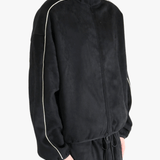 Black jacket worn by a person, showing the jacket's fit