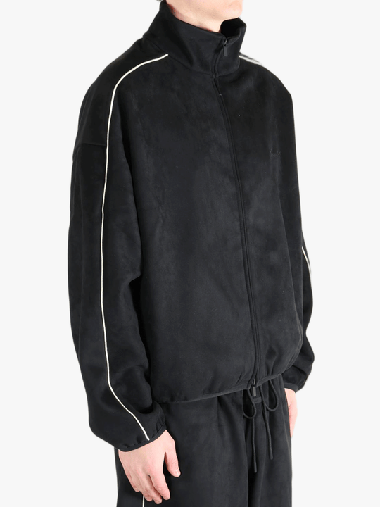 Black jacket worn by a person, showing the jacket's fit
