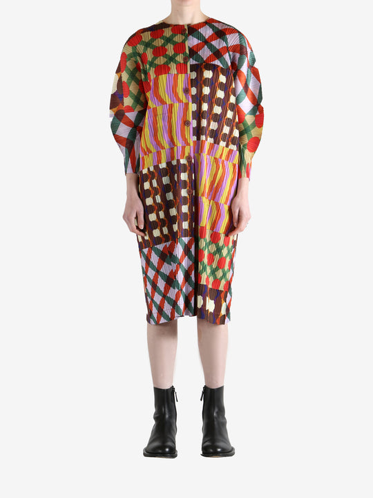 Pink coat worn by a person, showing the coat fit