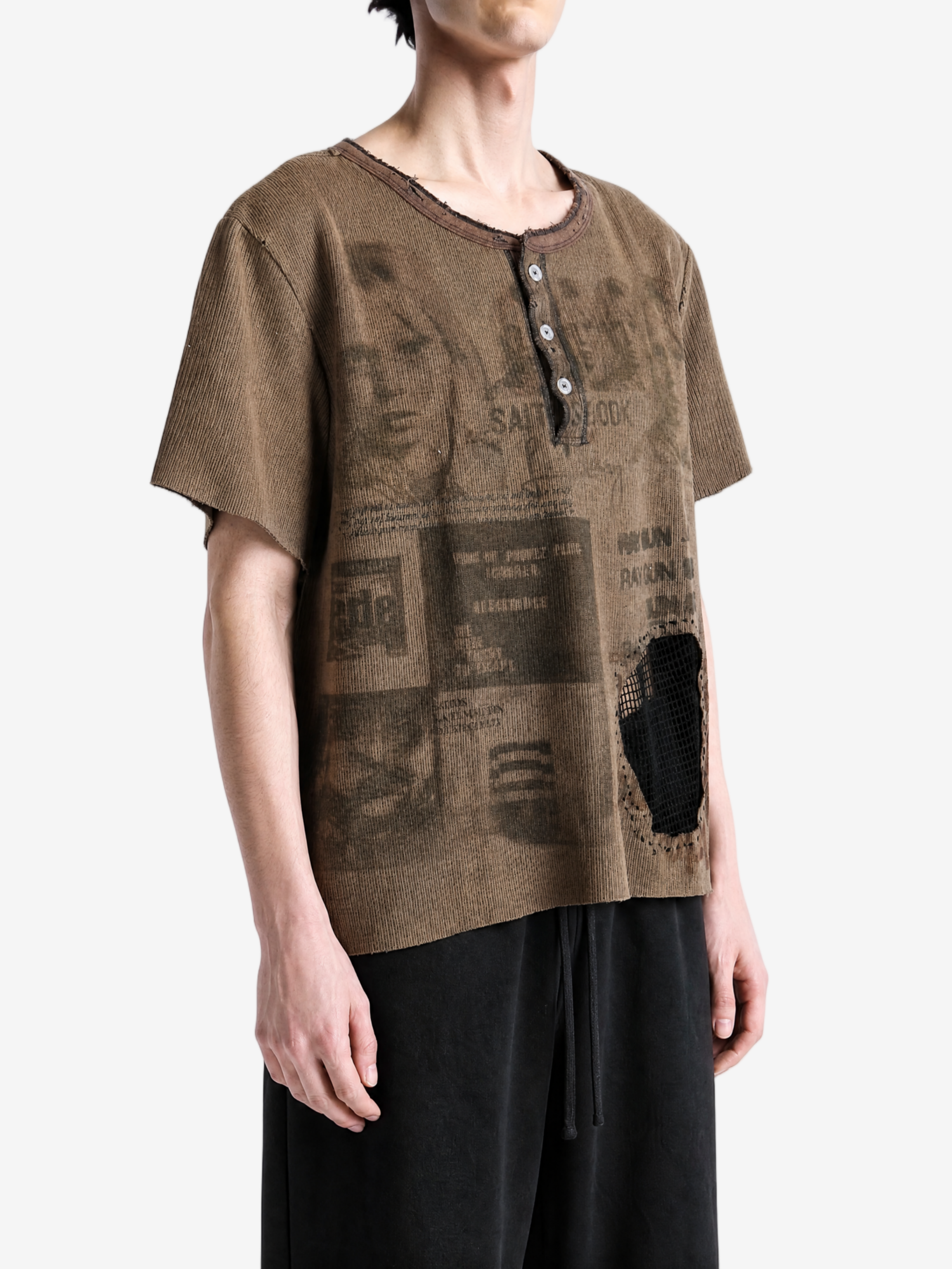 Brown t-shirt worn by a person, showing the t-shirt fit