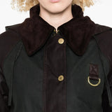 Close up of the green jacket, showing texture of the cotton fabric